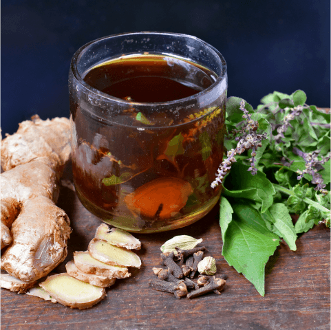 Cup of tea with ginger and herbs